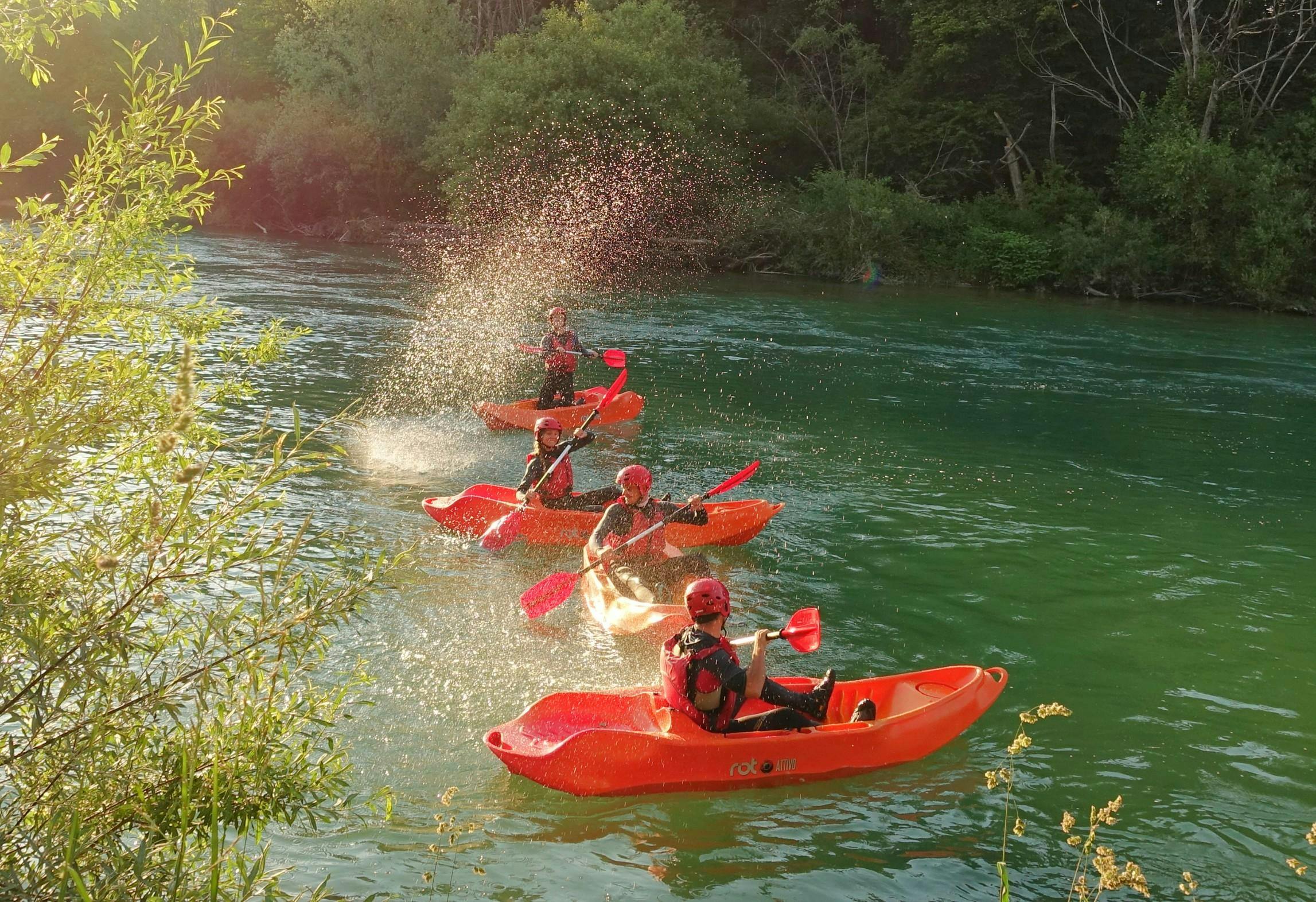 Classic Kayaking on the Sava River in Bled with Sava rafting Bled People in their Kayaks while Classic Kayaking on the Sava River in Bled with Sava rafting Bled.