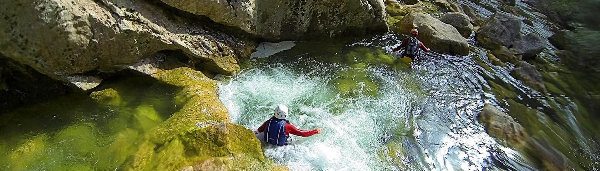 A person swimming during the Classic Canyoning on the Cetina River near Omiš with Adventure Omiš.