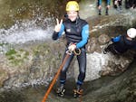 Participants having fun in a canyon at Jerecica Gorge during canyoning for beginners from Bled with Fun Turist Bled.