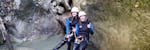 Participants sitting in a canyon at Grmecica Gorge during canyoning for explorers with Fun Turist Bled.