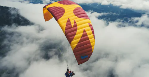 Tandem Paragliding in Carinthia - Relax Flight with Best Place - Flieger Base Villach A Tandem Paragliding flight above the clouds during Tandem Paragliding in Carinthia - Relax Flight with Best Place - Flieger Base Villach.