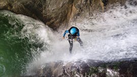 A person is abseiling during the Full Day Canyoning near Laruns in Ossau Valley with our partner Expérience Canyon.