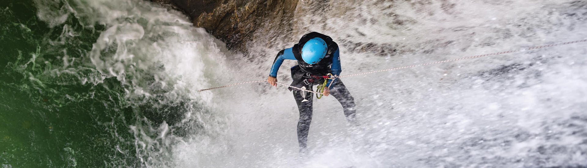 A person is abseiling during the Full Day Canyoning near Laruns in Ossau Valley with our partner Expérience Canyon. 