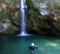 A Man jumping into the water during Rafting & Canyoning Combo on the Sava River whit Sava rafting Bled.