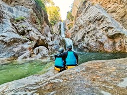 A couple is doing Canyoning in the Cetina River near Omiš - Basic Tour with Dalmare Travel Agency Omiš.