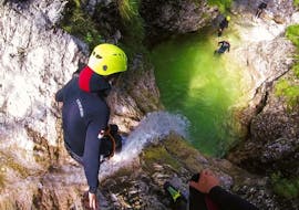 Someone is trying the Extreme Canyoning in the Fratarca Gorge with TOP Rafting Centre.