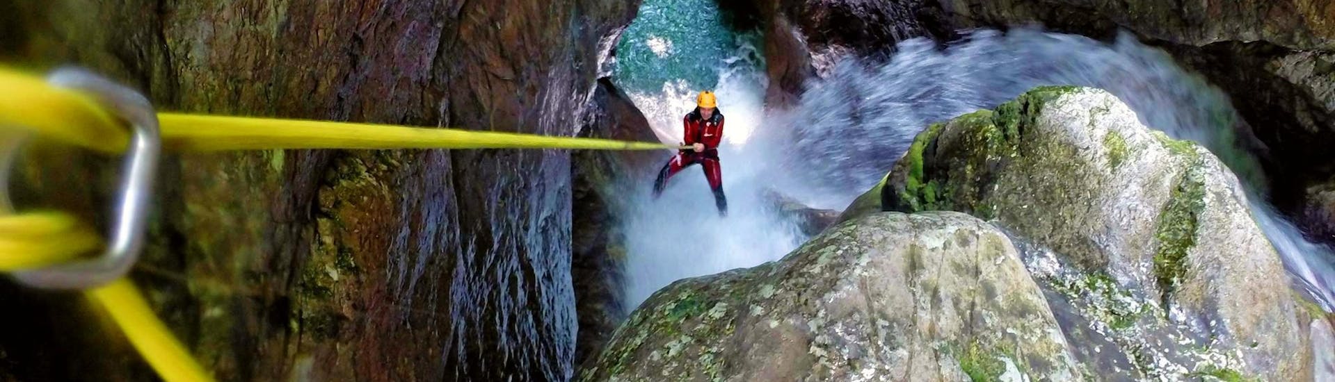 A participant abseiling during a challenging canyoning tour in the Kozjak Gorge near Kobarid with Soča Flow Kobarid.