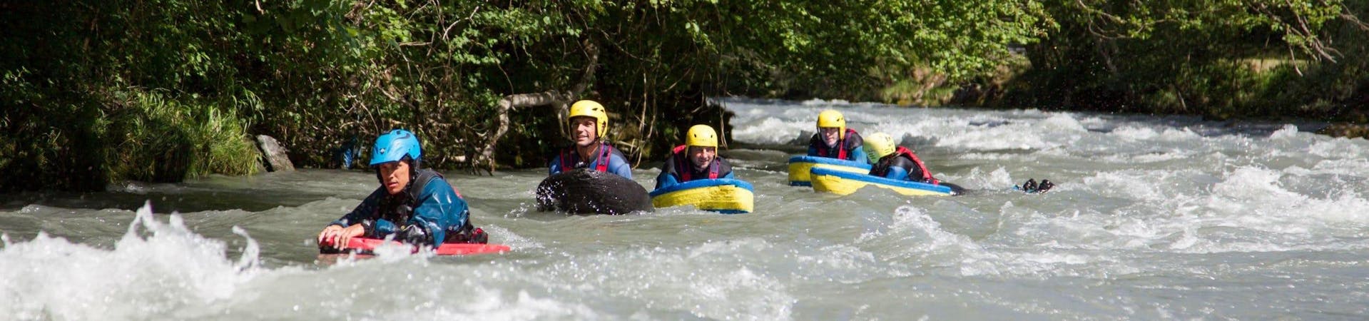 A group of friends is having fun during their Hydrospeed on Isère River - Advanced activity with Franceraft.