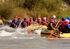 3 rafts are going down the Adda during the Rafting on the Adda for Groups 8+ people - Full Fun of Rafting Lombardia.