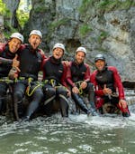 A happy group taking a break in the canyon during Canyoning in Strubklamm - Full Day Tour with Der Guide Brixental.