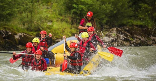 Sportive Rafting on the Salzach River in Salzburger Land from Torrent Outdoor Experience Golling A group of people riding the waves of Salzach River on their sportive rafting tour with Torrent Outdoor Experience.