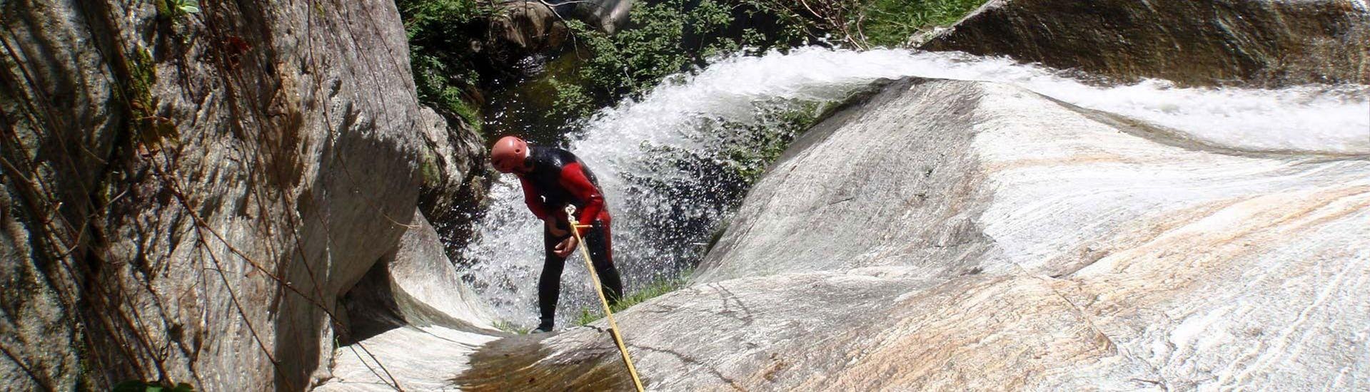 A man is looking at the height he achieved during the Canyoning in the Sorba with Eddyline - The River Experience Valsesia.
