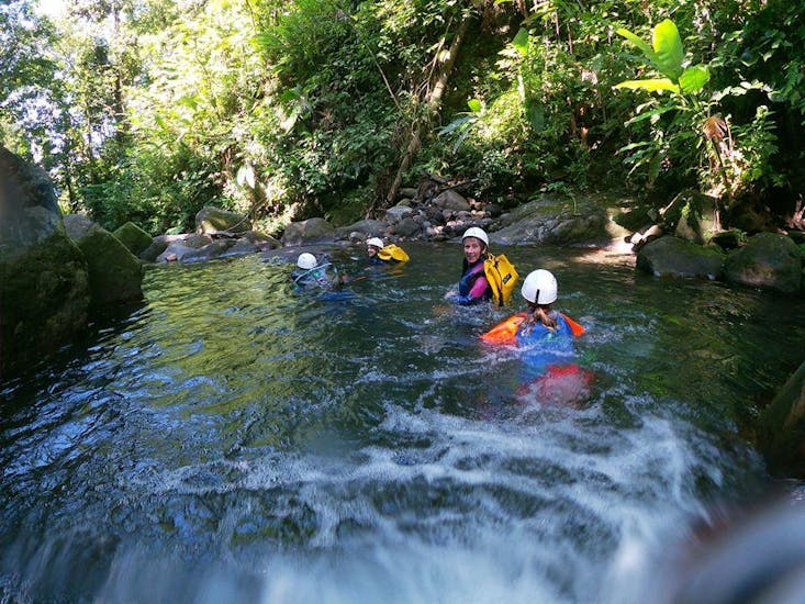 A group is enjoying the Canyoning in Ravine Chaude - Turquoise Waters activity operated by Vert Intense.