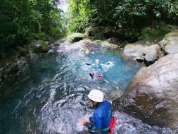 A group is enjoying the Canyoning in Ravine Chaude - Turquoise Waters activity operated by Vert Intense.