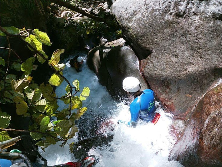 A person is participating to the Canyoning in Galion river - Ti-Canyon activity with Vert Intense.