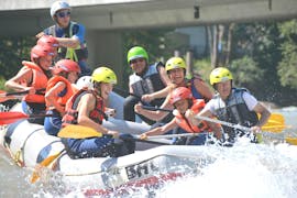 A group is having fun whilst participating in Rafting on the Enns River  organised by best adventure company Schladming.