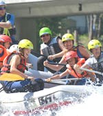 A group is having fun whilst participating in Rafting on the Enns River  organised by best adventure company Schladming.