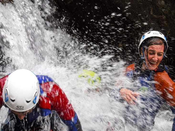 View of two people having fun during the Canyoning in the Chalamy - Test Yourself with Canyoning Valle D'Aosta