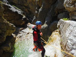 One person abseiling during fun canyoning near Lake Weissensee in Carinthia with ARES Drautal Canyoning.