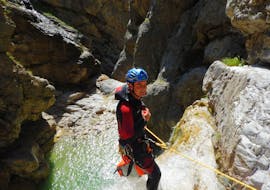 One person abseiling during fun canyoning near Lake Weissensee in Carinthia with ARES Drautal Canyoning.