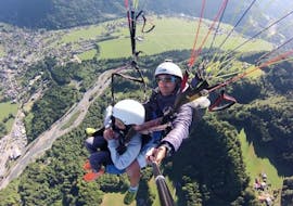 A child makes a Tandem Paragliding flight "Young Highlander" with Pegase Air over the Samoens valley.