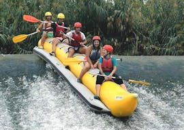 People are having fun whilst riding down a river during the Rafting "Banana Boat" - Rio Segura organised by Rafting Murcia.