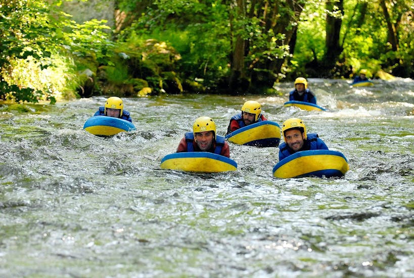 Some friends are trying to stay afloat during their Hydrospeed on Le Chalaux River - Action tour with AR Rafting Morvan.
