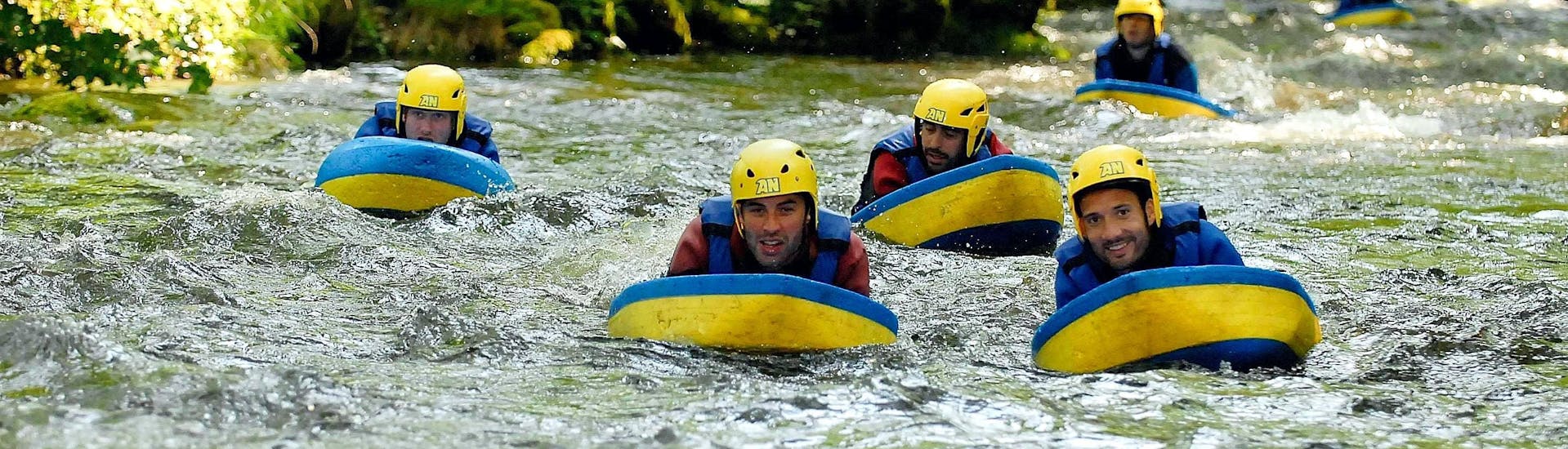 Some friends are trying to stay afloat during their Hydrospeed on Le Chalaux River - Action tour with AR Rafting Morvan.