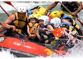 A group of kids have fun while rafting on the Rio Esera with Sin Fronteras Adventure.
