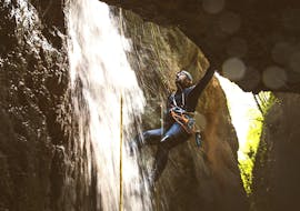 A boy faces a rope passage during Canyoning in Rio Inferno organized by Rockonda.