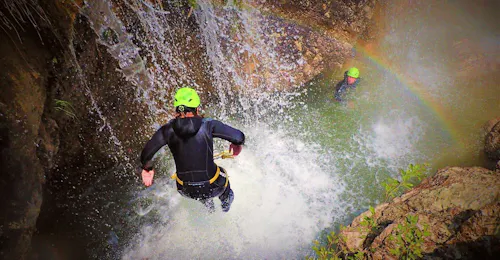 Canyoning at Torrente Toscolano - Summerrain with skyclimber Tremosine A participant of the Canyoning at Torrente Toscolano - Summerrain of Skyclimber is jumping into the water.