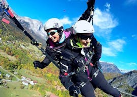 A woman is enjoying her Tandem Paragliding at Planpraz - Discovery activity with Les Ailes du Mont Blanc.