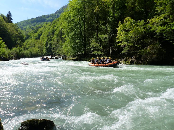 A group of friends is enjoying their Rafting on Dranse River - Special activity with AN Rafting Haute-Savoie.