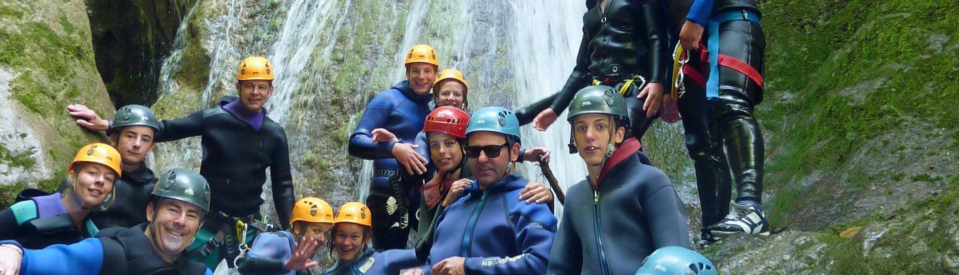 A family is posing during the Canyoning in Saury's Mine activity with FBI Parapente.