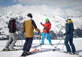 People are participating in adult ski lessons "beginners special" for first-timers with Top Secret ski school in Davos.