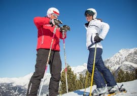 The ski instructor from Sertorelli Ski School Bormio is teaching a participant the right technique during the Private ski lessons for adult for all levels.