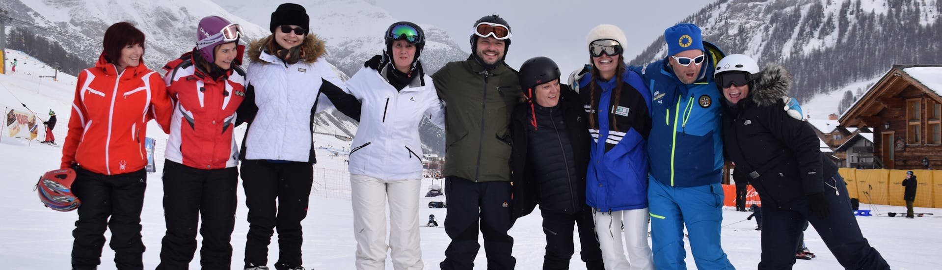 Participants posing for a picture in Livigno after one of the adults ski Lessons for all levels. 