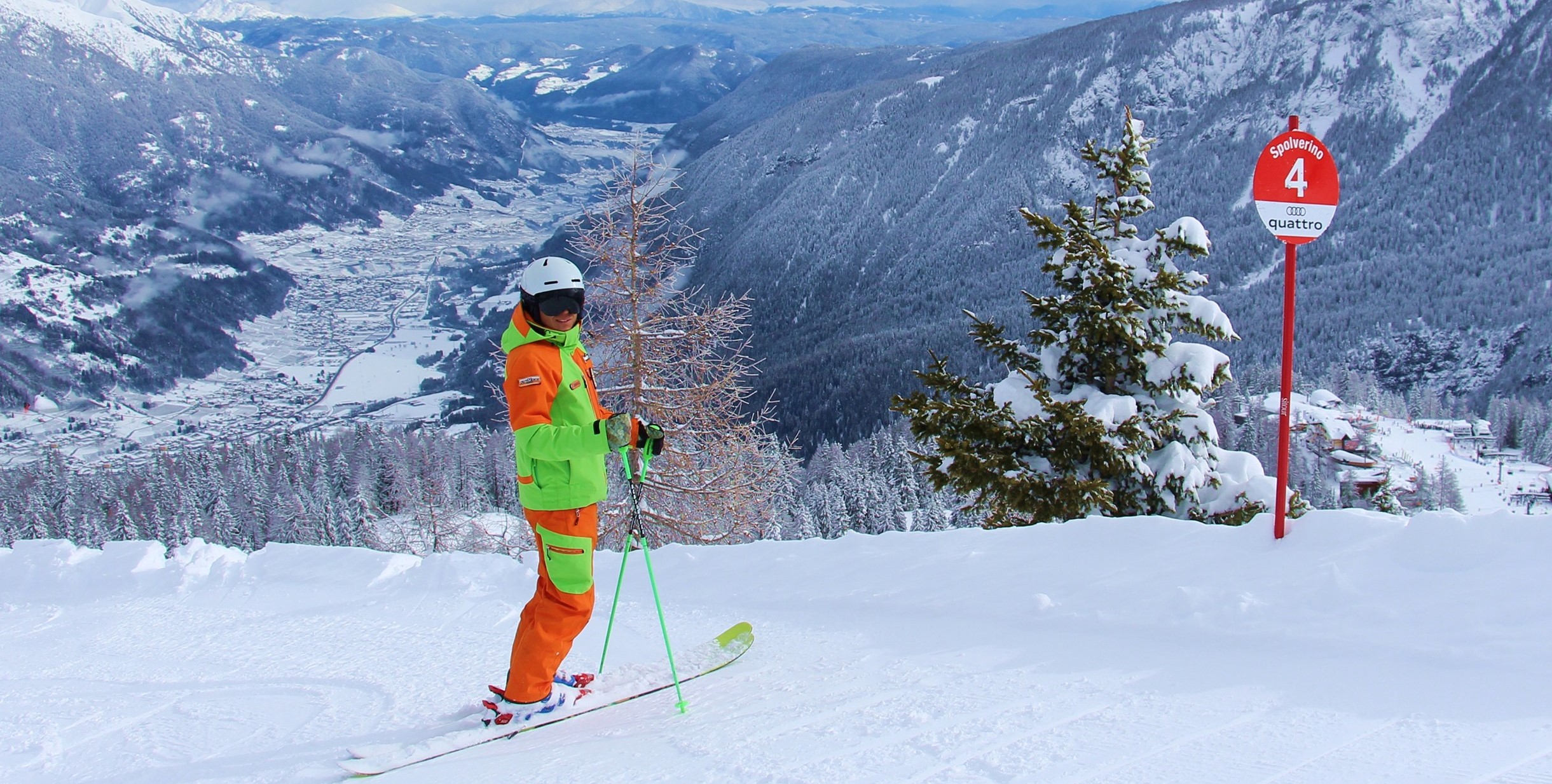 Ski instructor enjoying the view of Folgarida before one of the private freestyle skiing lessons for all levels.