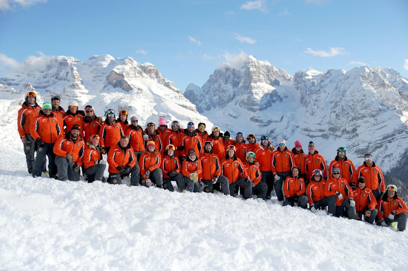 Ski instructors taking a picture in Madonna di Campiglio before one of the Adult Ski Lessons for All Levels.