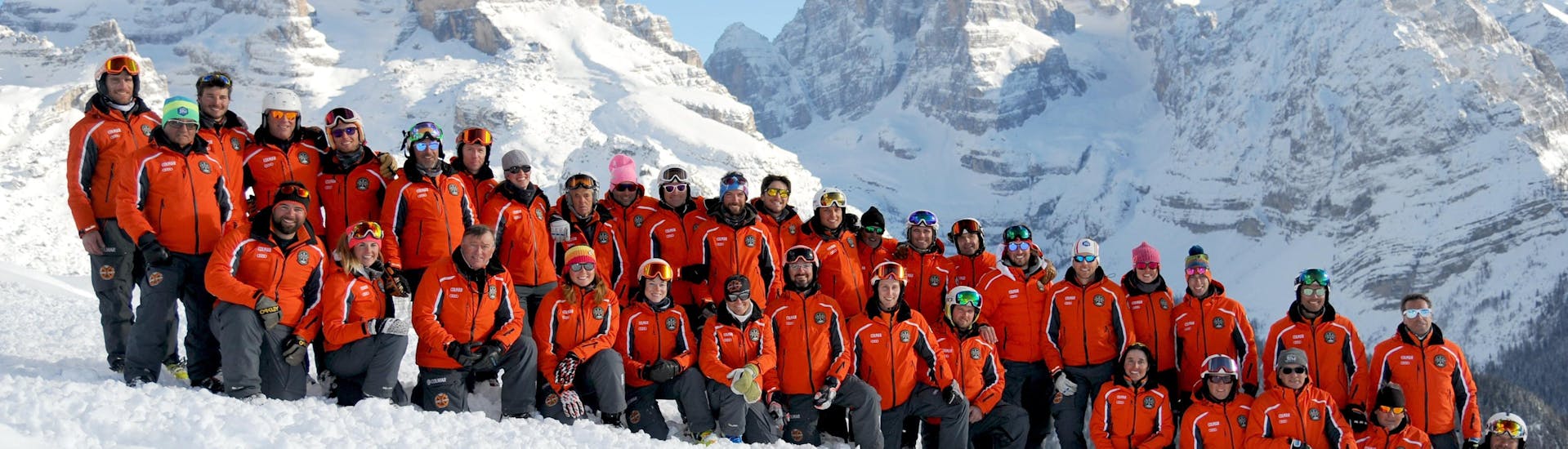 Ski instructors taking a picture in Madonna di Campiglio before one of the Adult Ski Lessons for All Levels.