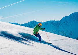 A skier rides down the slopes with an instructor from Scuola di Sci B.foxes during the Private Off-Piste Skiing Lessons - for Adults.