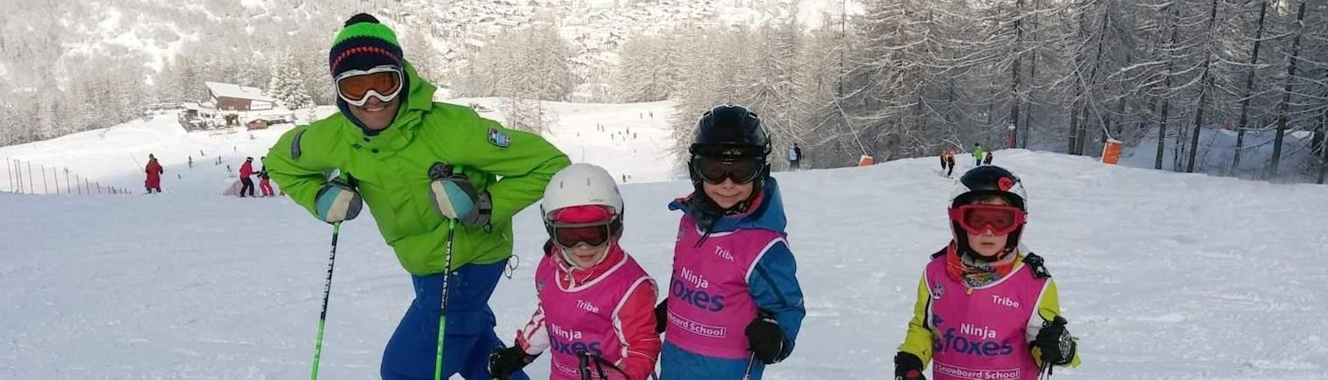 Kids are having fun in Kids Ski Lessons (3-6 y.) - Beginner - Christmas in the ski school Scuola di Sci B.foxes.