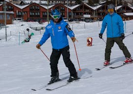 Ski instructor and participant in Sestriere during one of the Private Ski Lessons for Adults of All Levels.