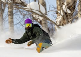 A snowboarder enjoying the private snow during his Private Snowboarding Lessons for Kids & Adults - All Levels from Out of Bounds Snowboard School .