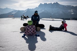Kids doing Snowboarding Lessons for Kids (6-15 y.) for All Levels from Ski School ESI Morgins M3S.