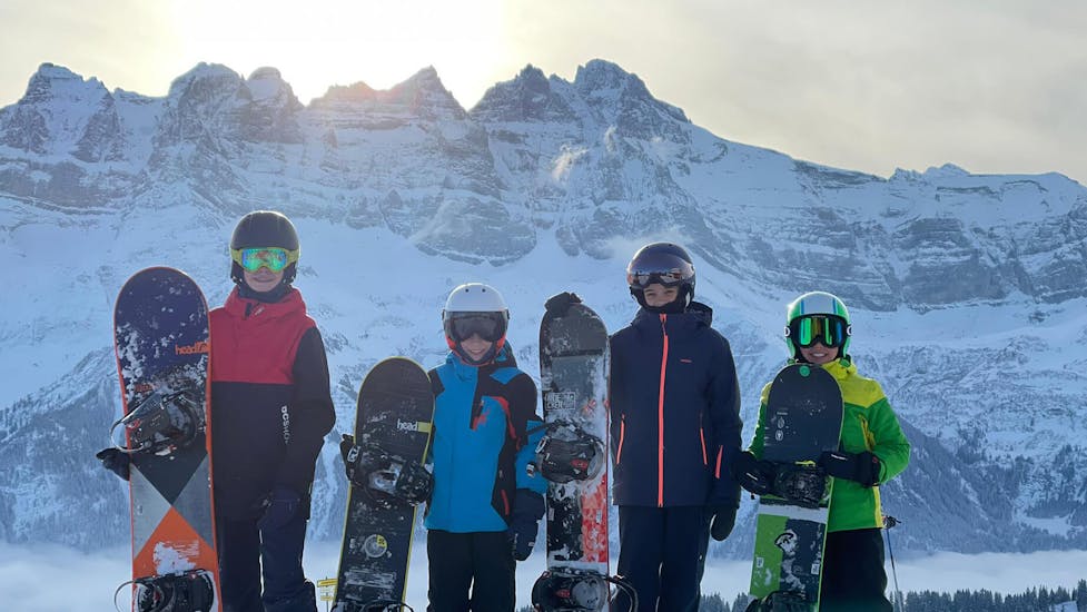 Kids doing Snowboarding Lessons for Kids (6-15y.) for All Levels with ESI Morgins M3S.