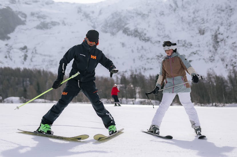 Instructor helping a young adult during a Private Ski Lesson for Adults of All Levels in Chamonix.