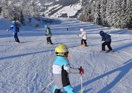 Kid starting his adventures on the snow during one of the kids ski lessons for first timers in Monte Elmo.