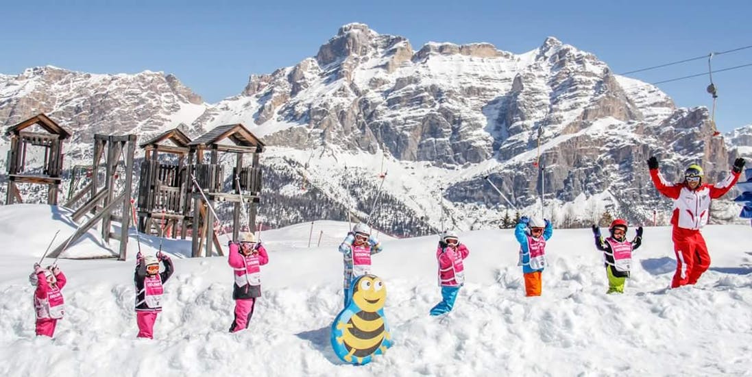 Kids and ski instructor enjoying their time in San Cassiano during one of the kids ski lessons (4-12 y.) for beginners.