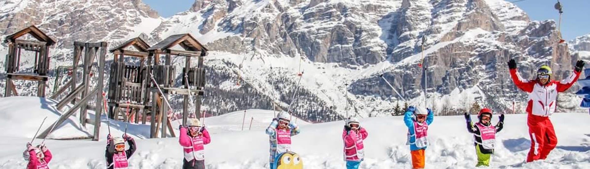 Kids and ski instructor enjoying their time in San Cassiano during one of the kids ski lessons (4-12 y.) for beginners.